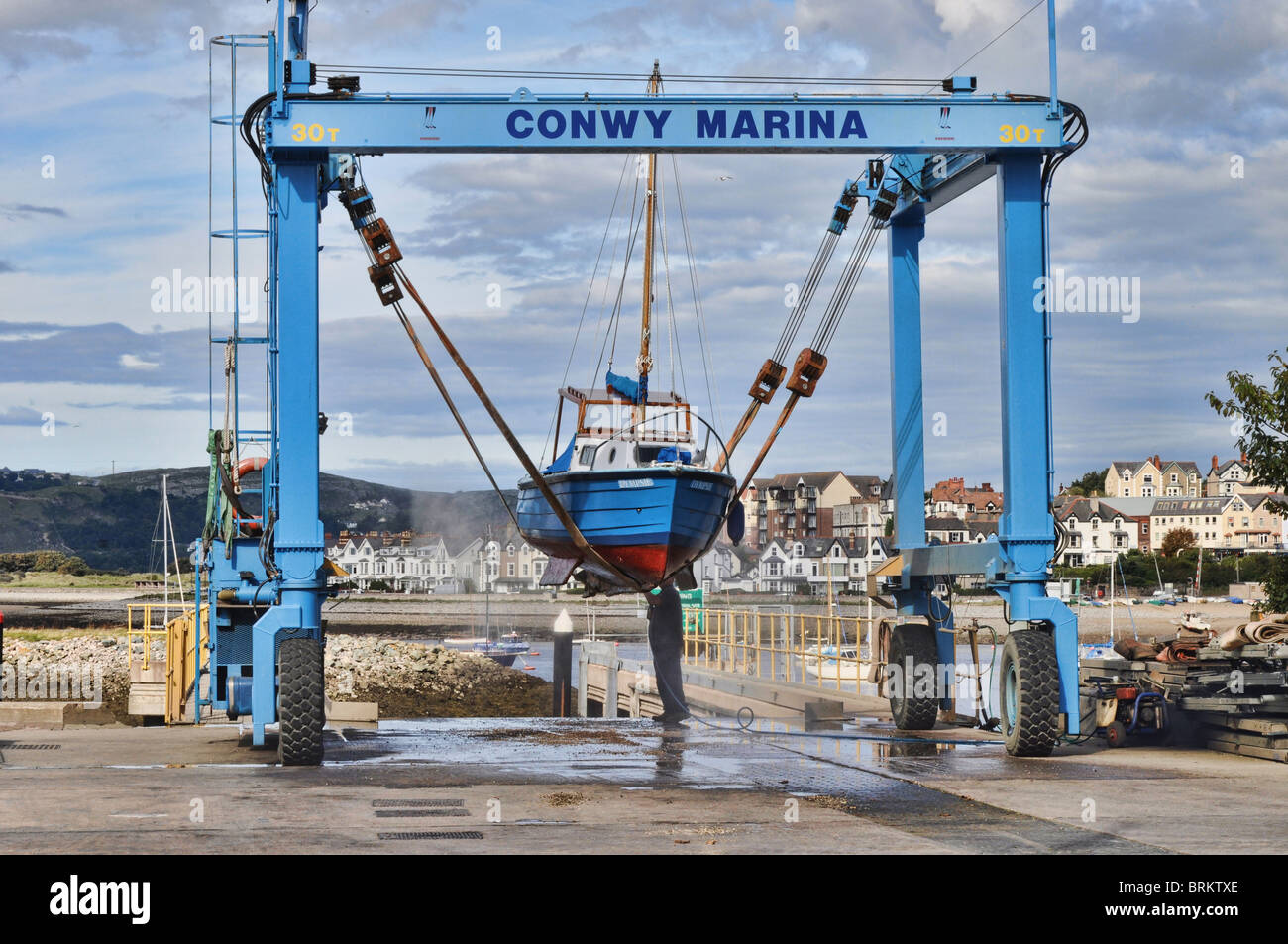 Boat cleaning in Conway Marina Stock Photo, Royalty Free Image