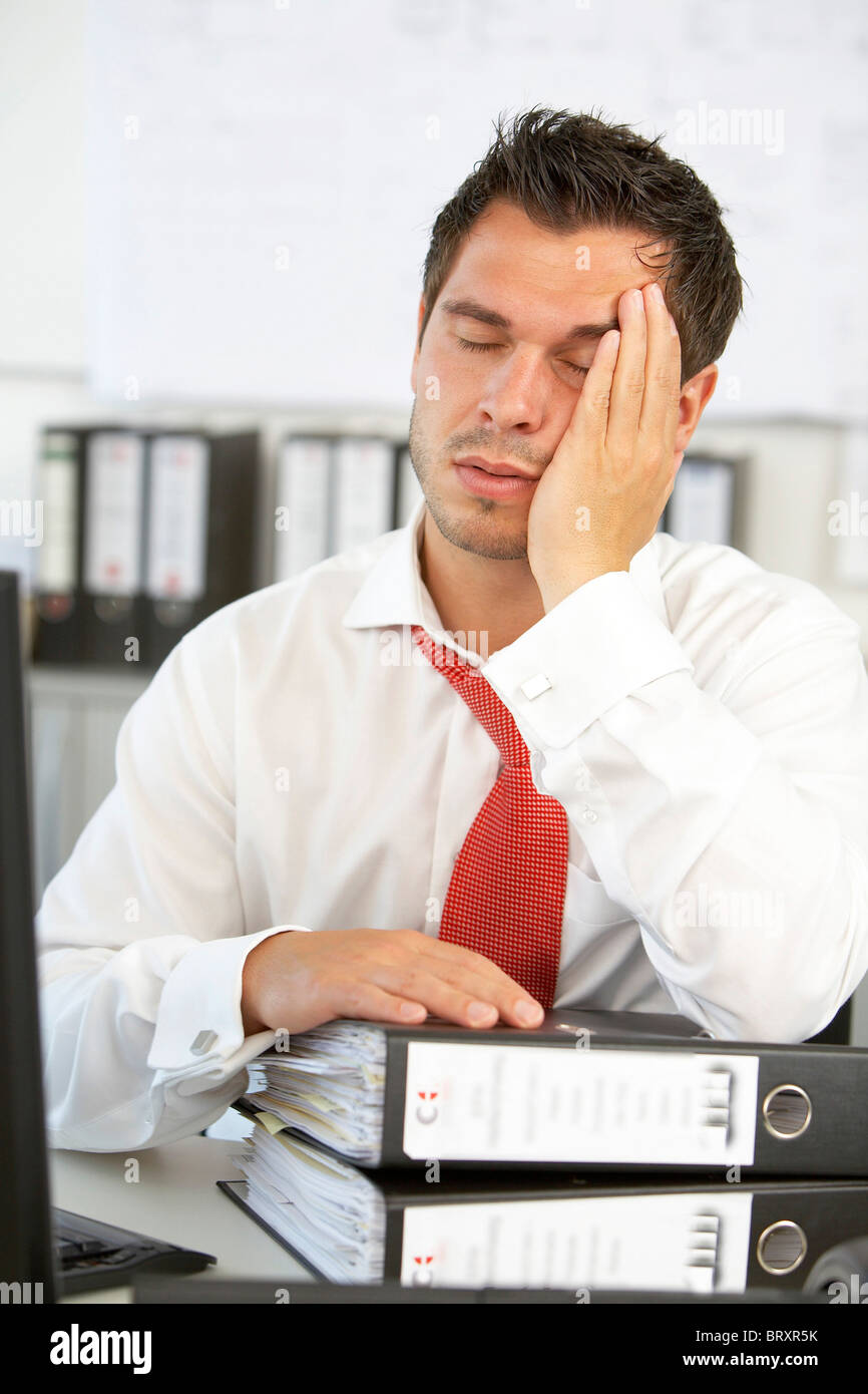 Exhausted man in the office Stock Photo Royalty Free Image: 31936399 Exhausted man in the office Stock Photo Royalty Free Image: 31936399
