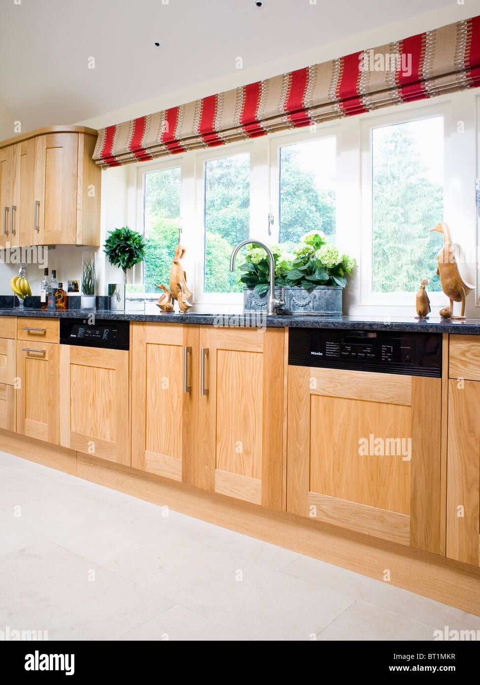 Red+beige wide-striped blind on large window in modern country Red+beige wide-striped blind on large window in modern country