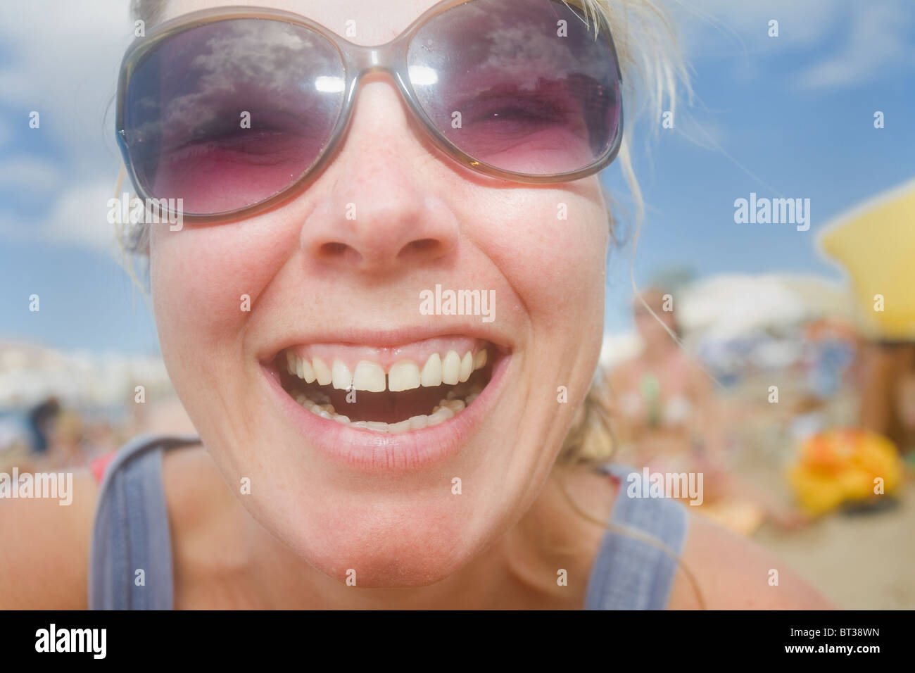 Save preview image - woman-smiling-on-the-beach-in-las-palmas-de-gran-canaria-BT38WN