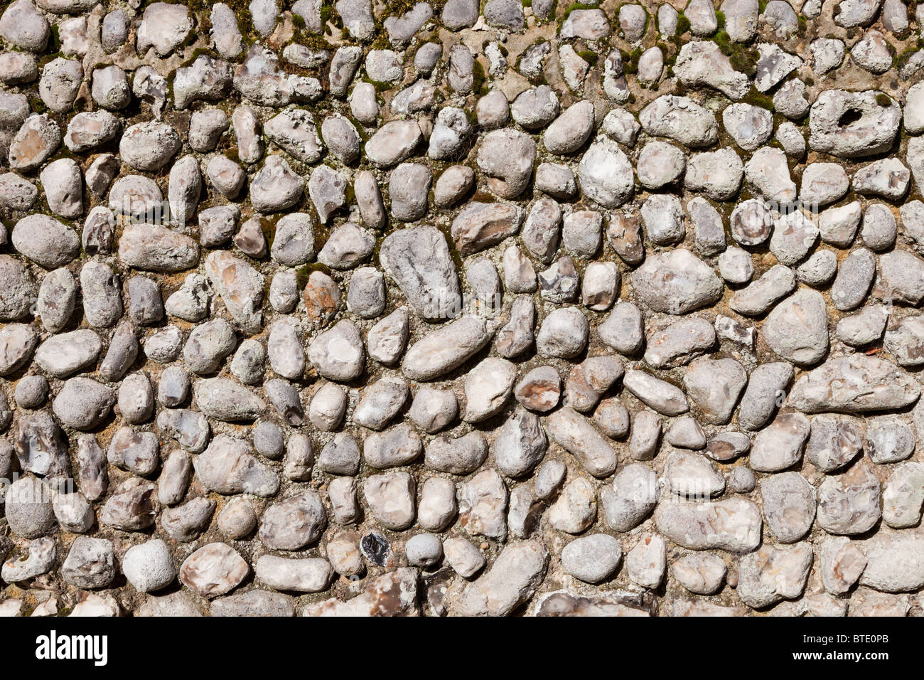 Traditional knapped flint stone wall in Norfolk, England Stock Photo