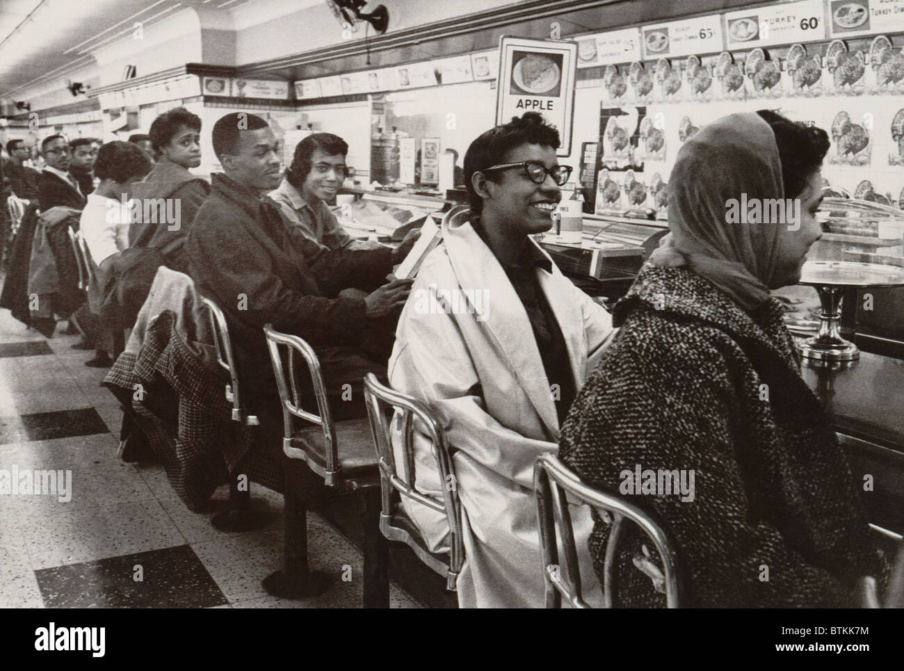 African Americans sit in protest at a whites-only lunch counter in Stock Photo ...