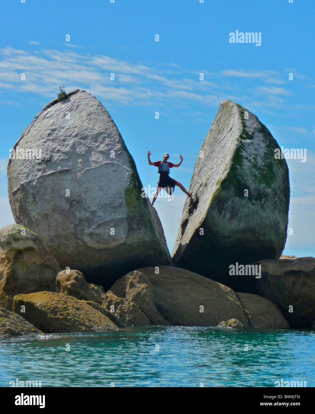 A unique rock formation known as Split Apple Rock surfaces out of the