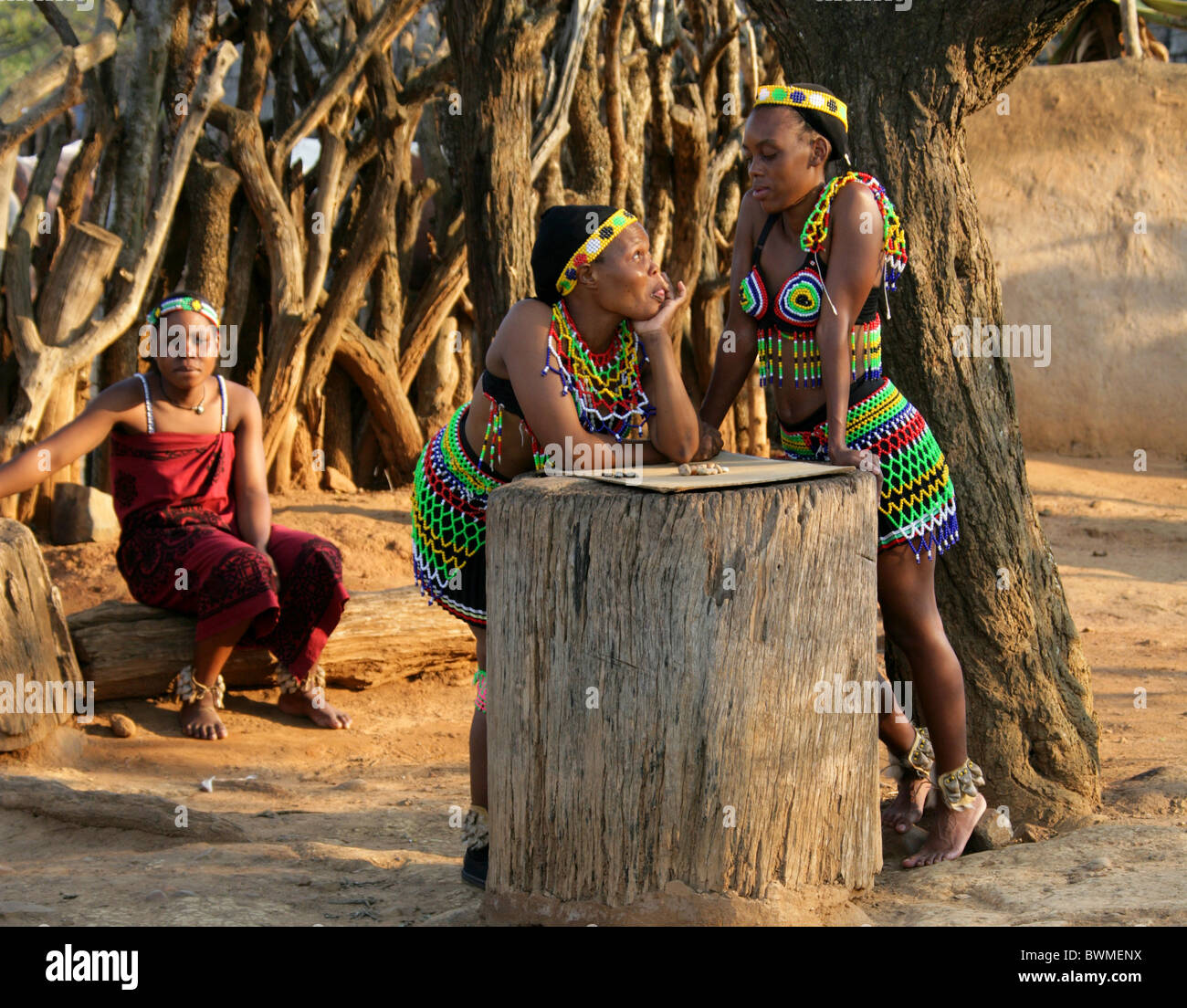 Zulu Girls in Traditional Beaded Costumes Playing a Board Game with