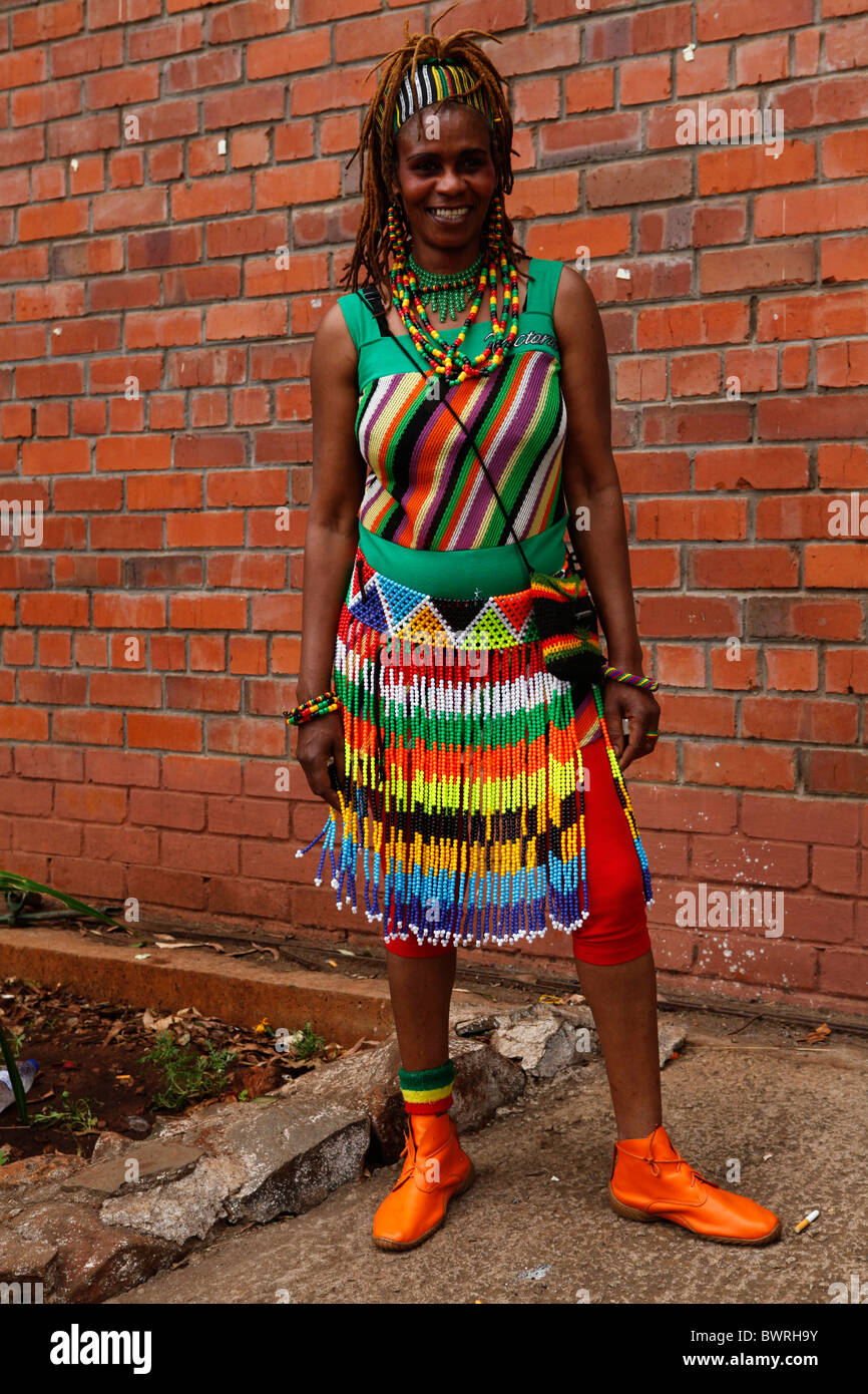 An African woman wears brightly coloured clothing in Harare Stock Photo