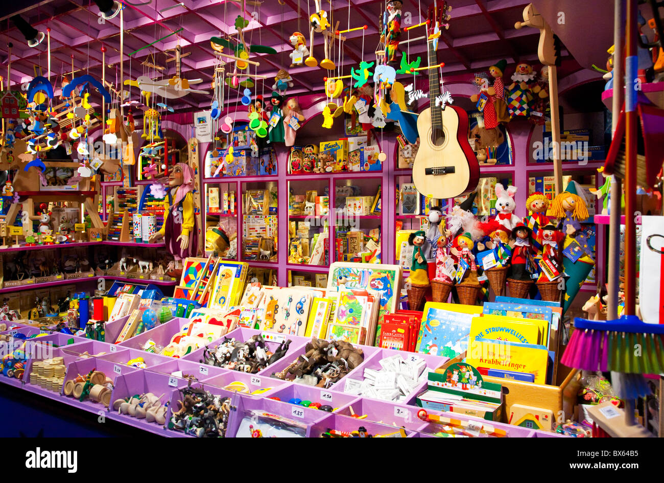 Market stall selling wooden toys at the Munich christmas market Stock