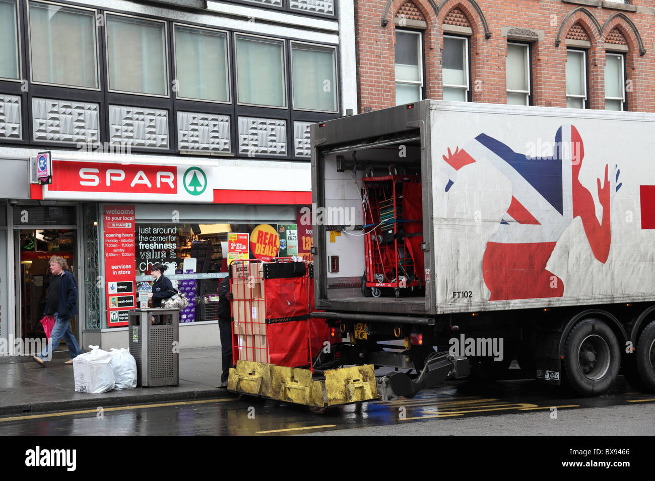 A truck delivering to Spar convenience store in a U. K. city Stock