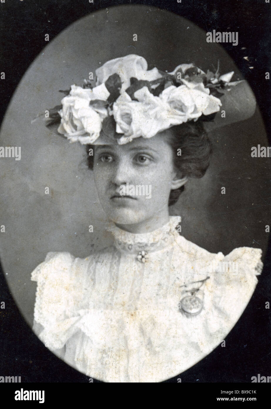 young woman wearing Edwardian Victorian period tea hat flowers Stock
