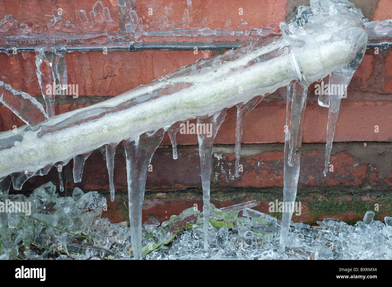 Frozen waste pipe, caused by a burst outside tap Stock Photo, Royalty