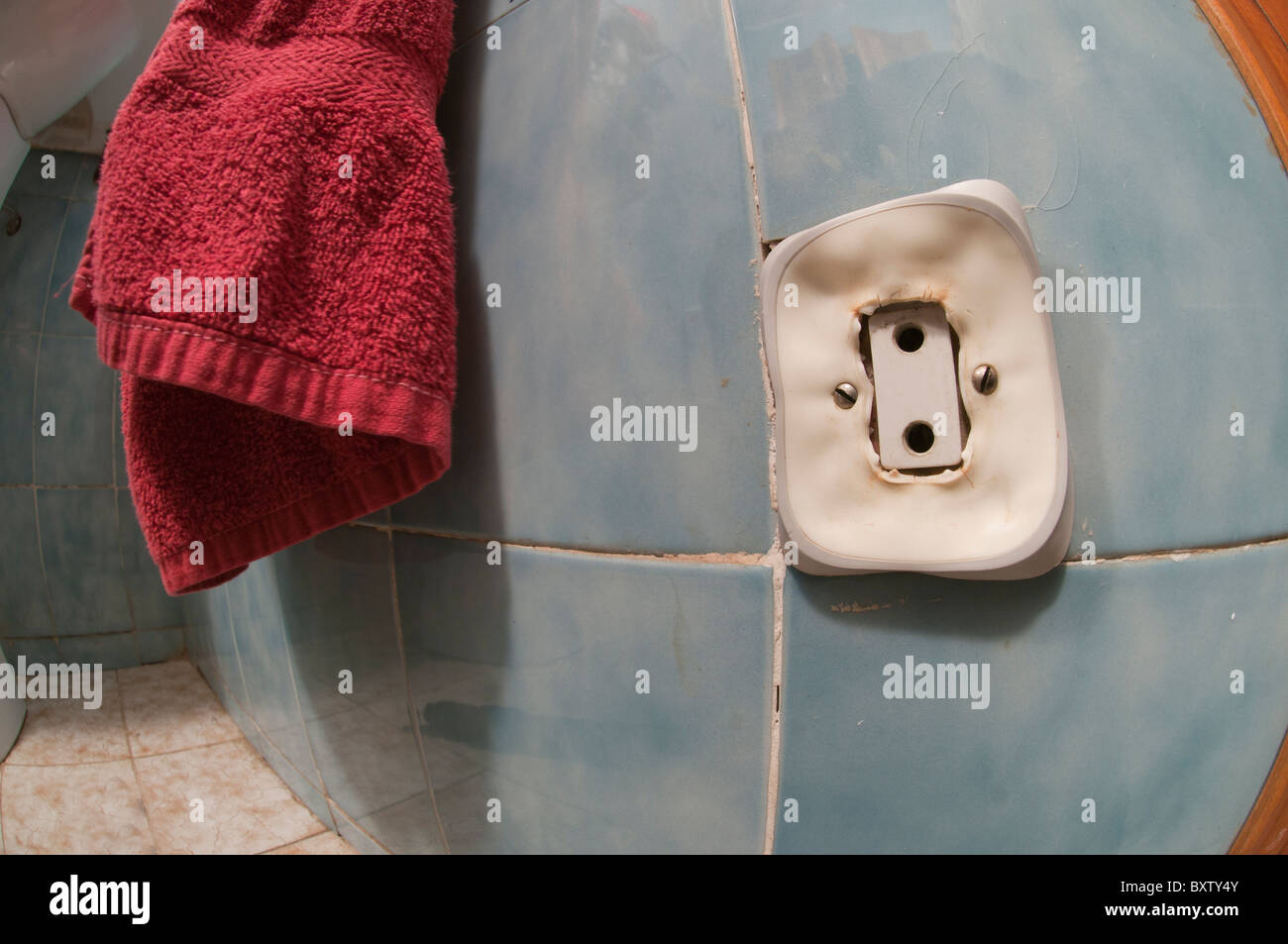 Electric wall outlet in dangerous melting process due to overheating Stock Photo, Royalty Free