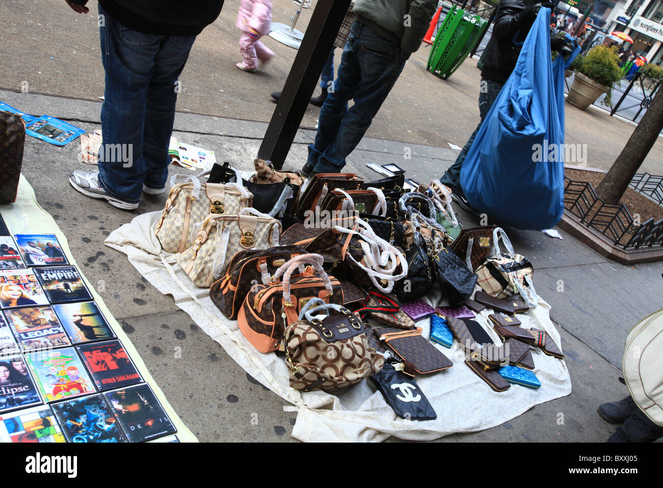 Counterfeit fake designer handbags on sale on sidewalk in New York Stock Photo, Royalty Free ...