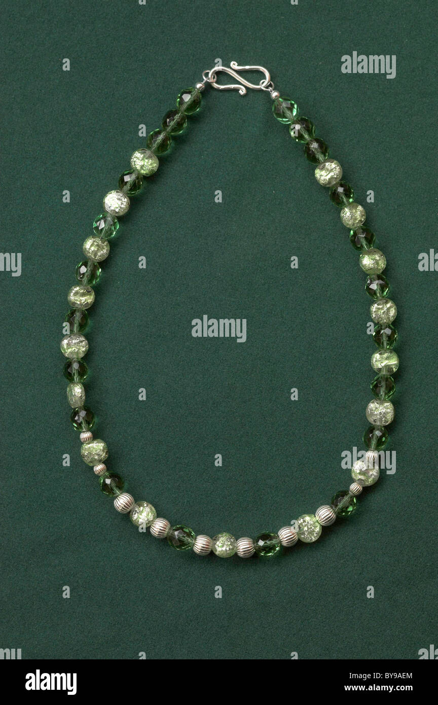 A vintage green glass bead necklace with silver beads and clasp Stock