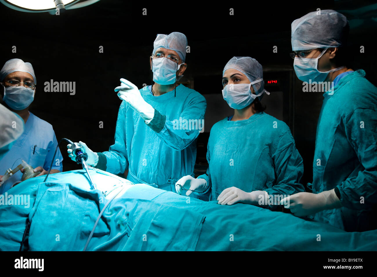 Surgeons Performing An Operation Stock Photo Alamy