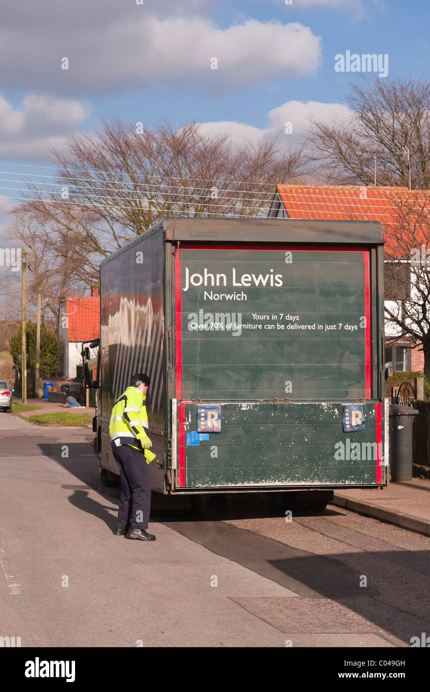 A John Lewis delivery lorry delivering goods in the Uk Stock Photo
