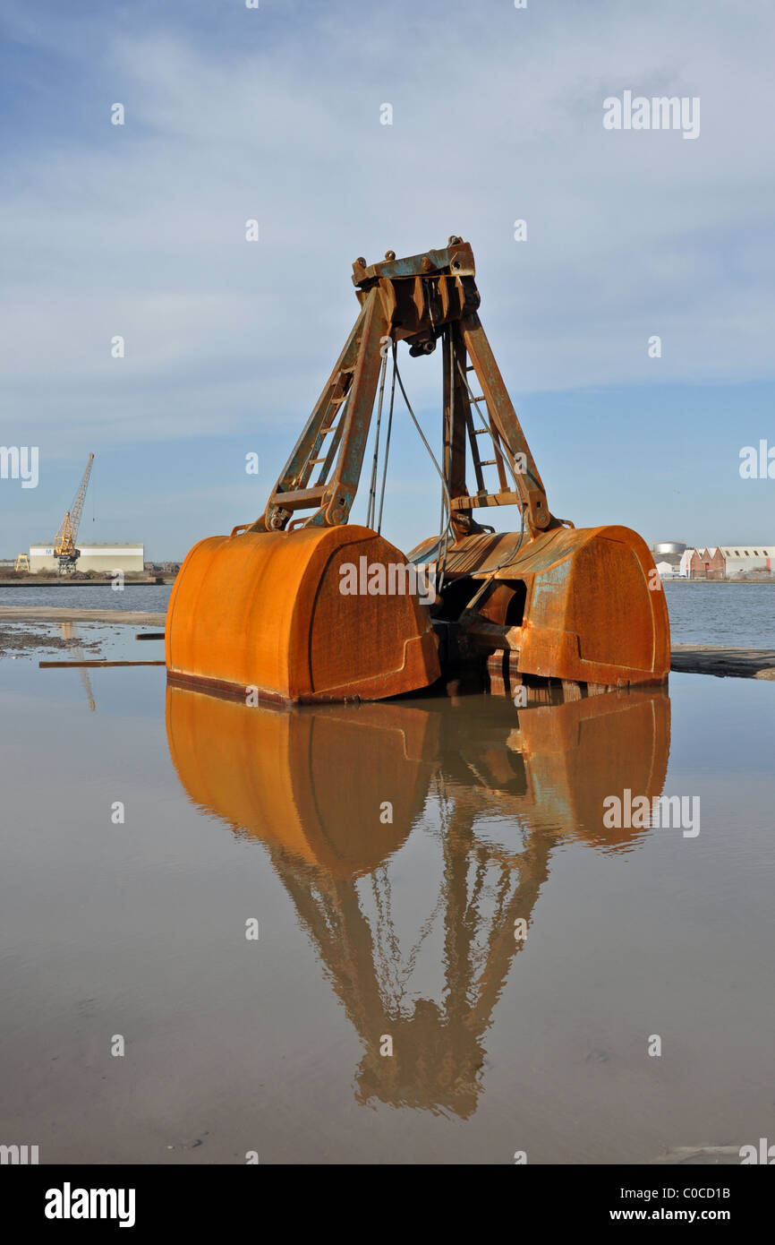 A Clamshell bucket of the type used on crawler cranes, sitting on a