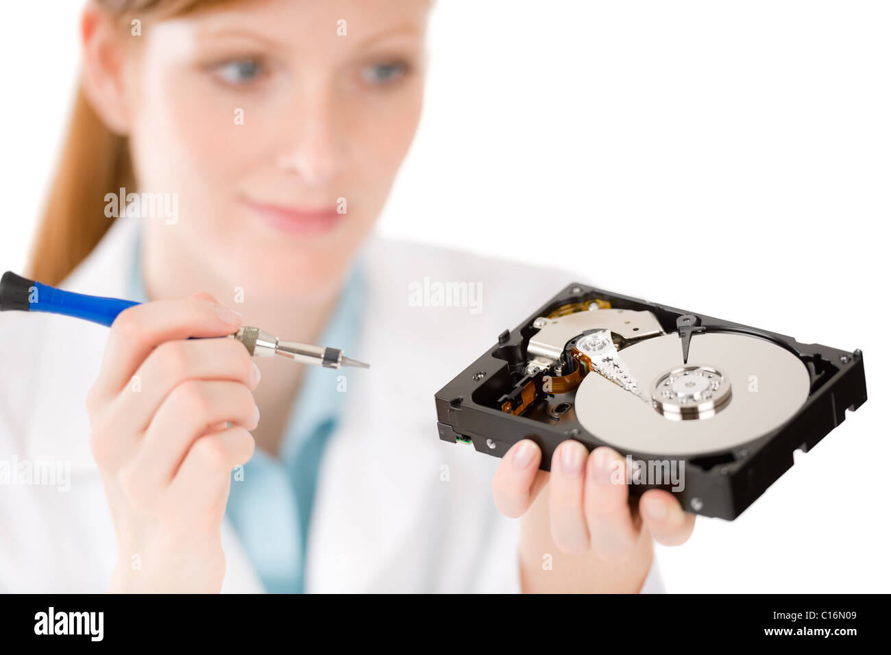 Female computer engineer - IT woman repair <b>hard disc</b> defect Stock Photo - female-computer-engineer-it-woman-repair-hard-disc-defect-C16N09