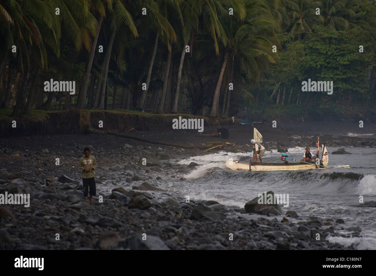 Balinese Fishermen Pull Up On The Beach In Tembok Bali After A Night