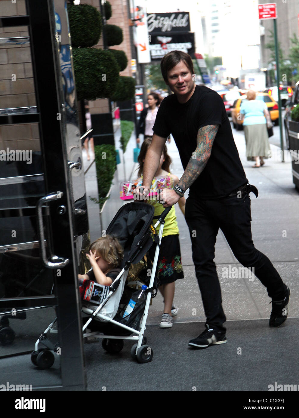 Tom DeLonge walks through Soho with his daughter Ava Elizabeth New