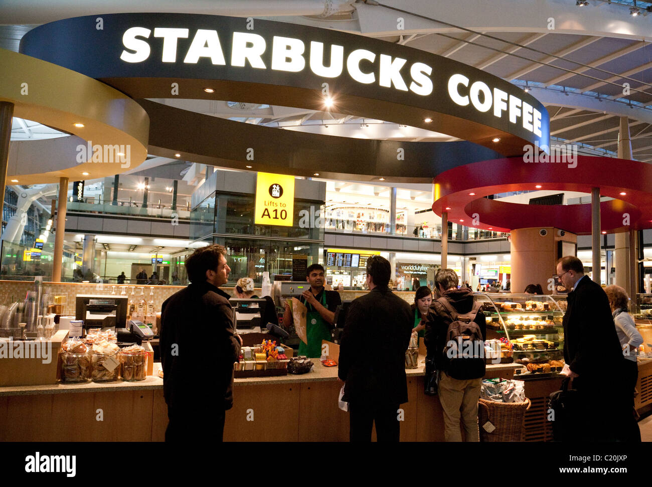 People being served at Starbucks Coffee bar, in terminal 5, Heathrow