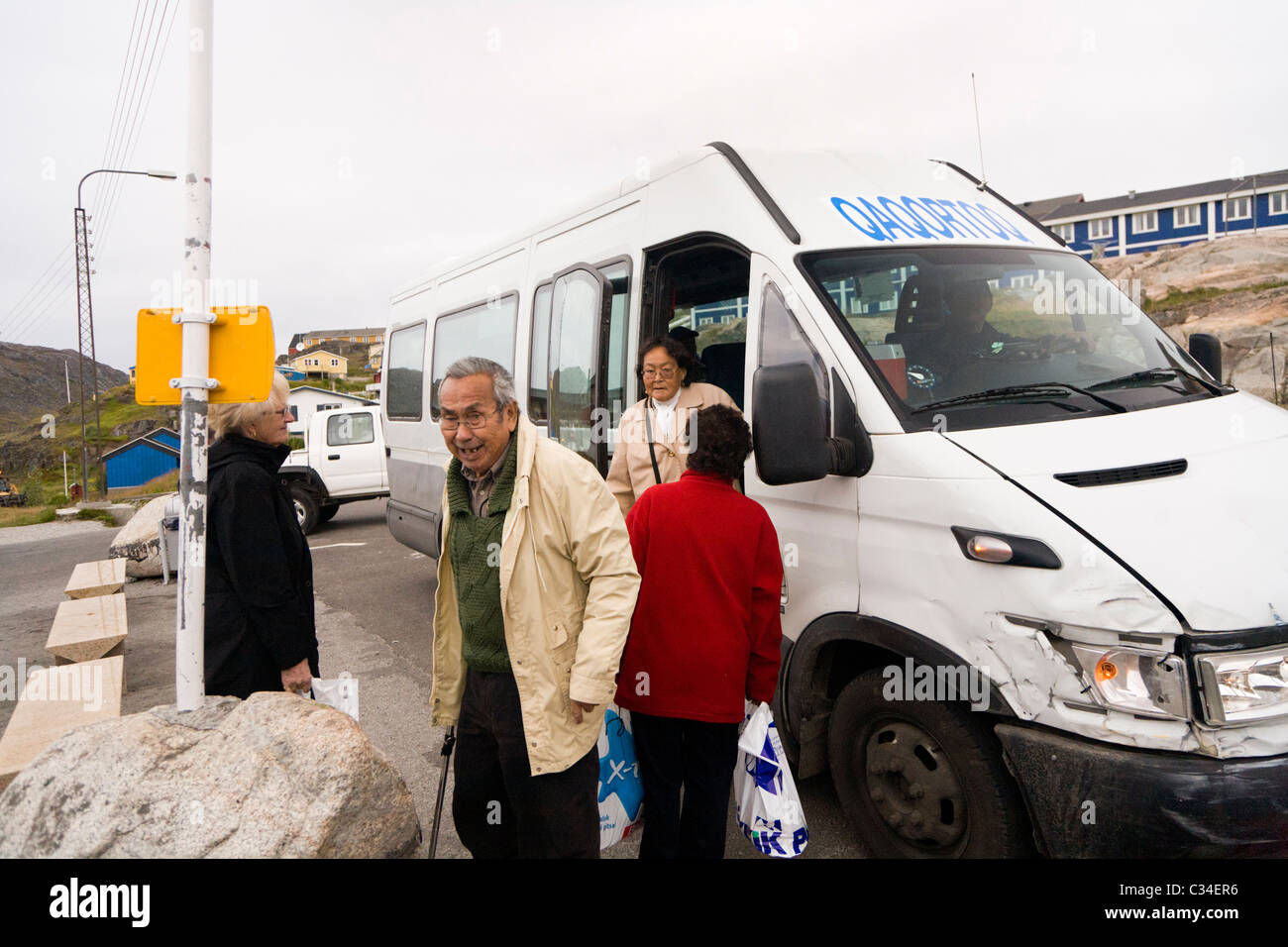 People leaving a bus. Qaqortoq (Julianehåb), South Greenland Stock