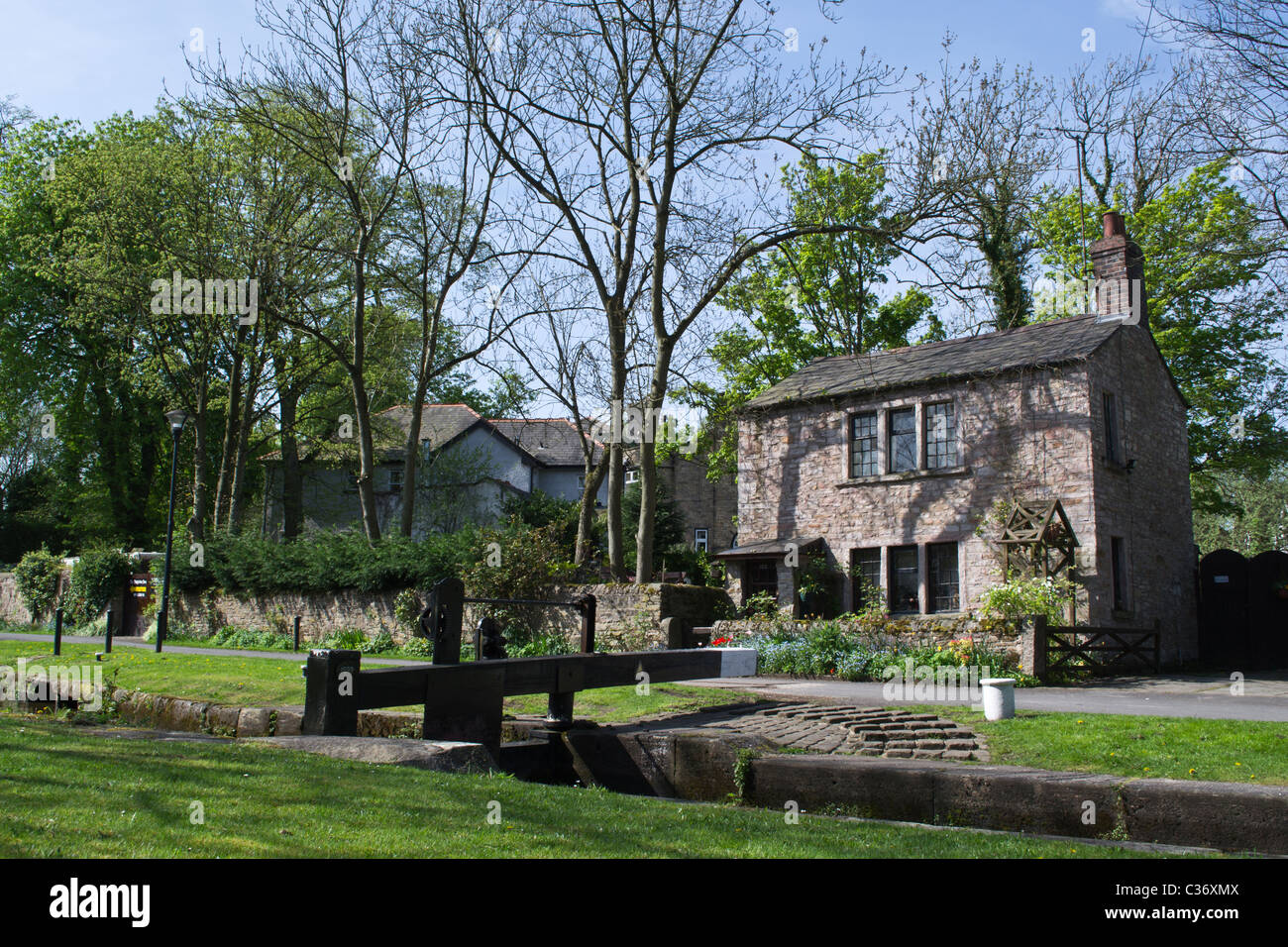 canal side lock gate and lock keepers cottage marple cheshire Stock