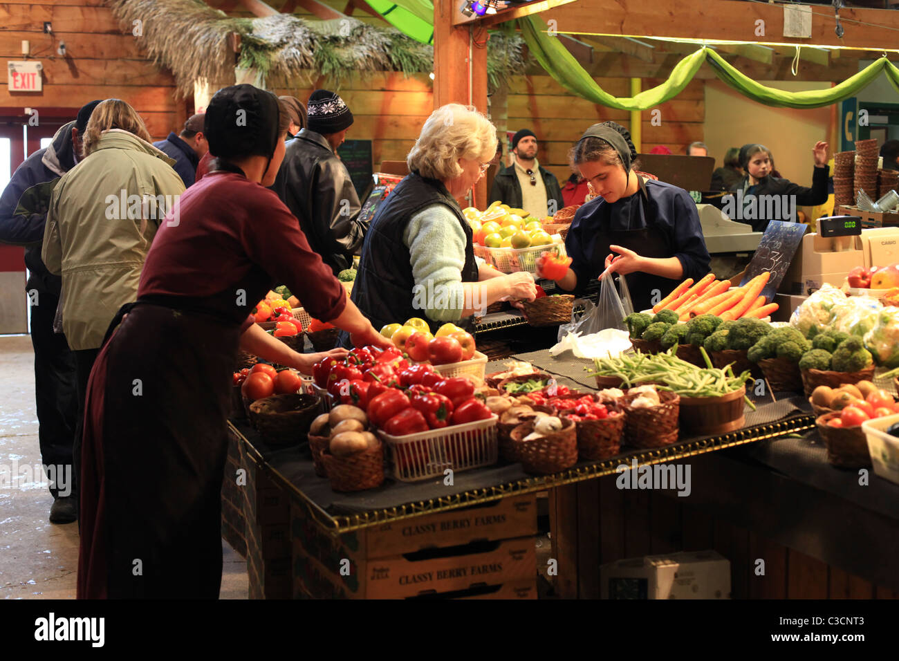 Amish woman selling local products at St. Jacobs farmers' market in