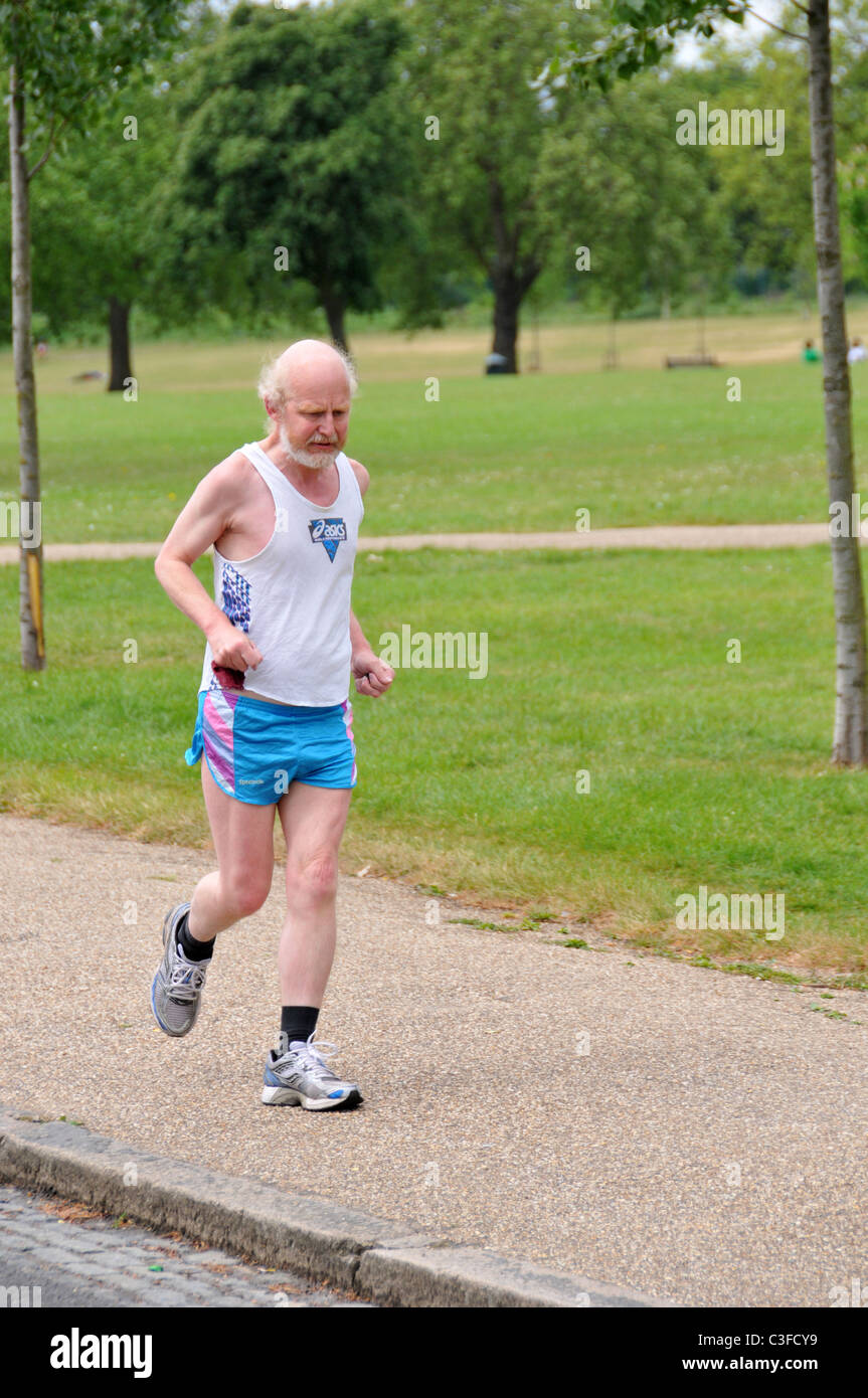 Old man senior citizen pensioner Runner running keeping fit in Stock Photo, Royalty Free Image