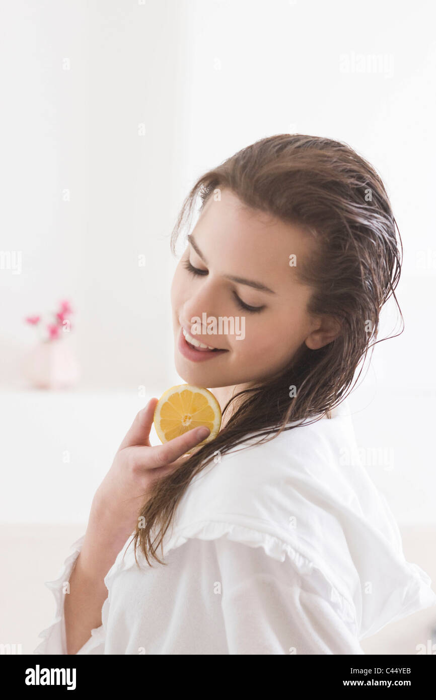 Woman Squeezing Lemon Juice On Hair Stock Photo 36988739 Alamy