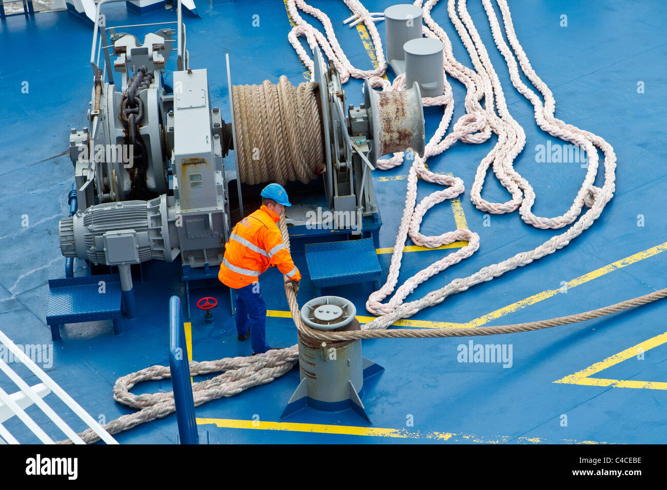 seaman seamen deckhands working work ship winch ropes warps Stock Photo, Royalty Free Image