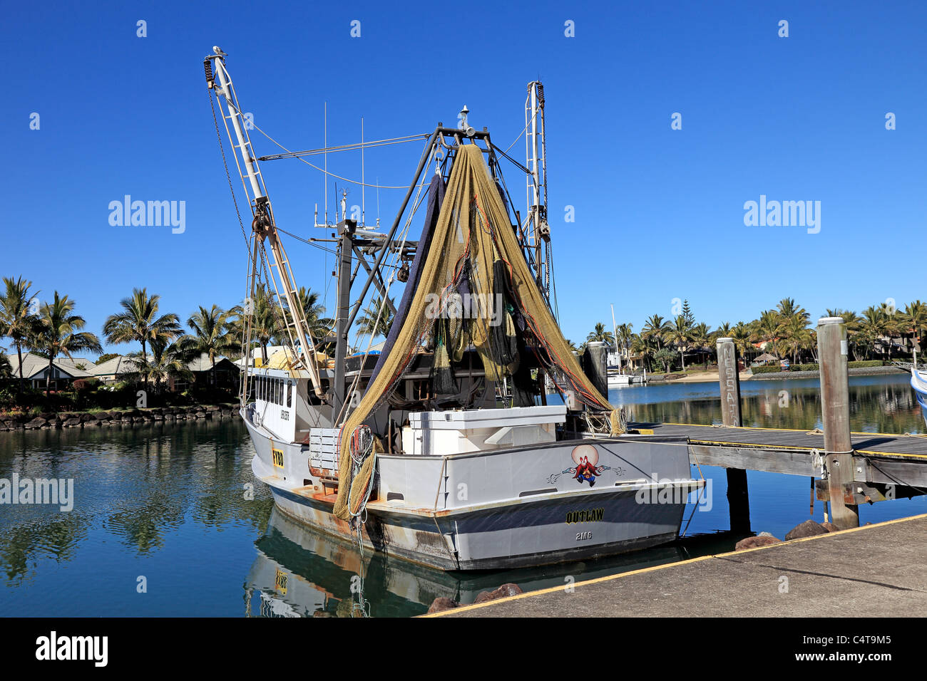 Fishing Boats At Rest In River Estuary Moored At A Pier Stock Photo Alamy