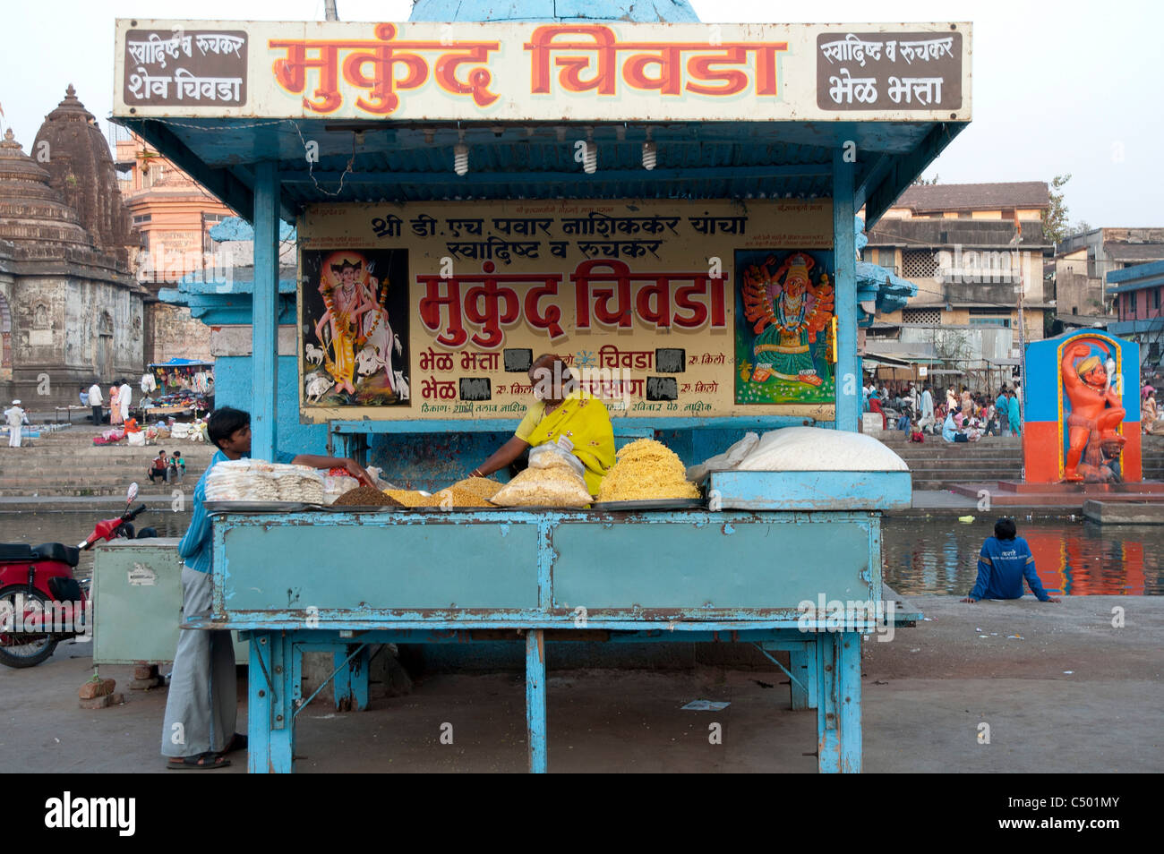 Street vendor sells Indian food off a street stall. Photographed in