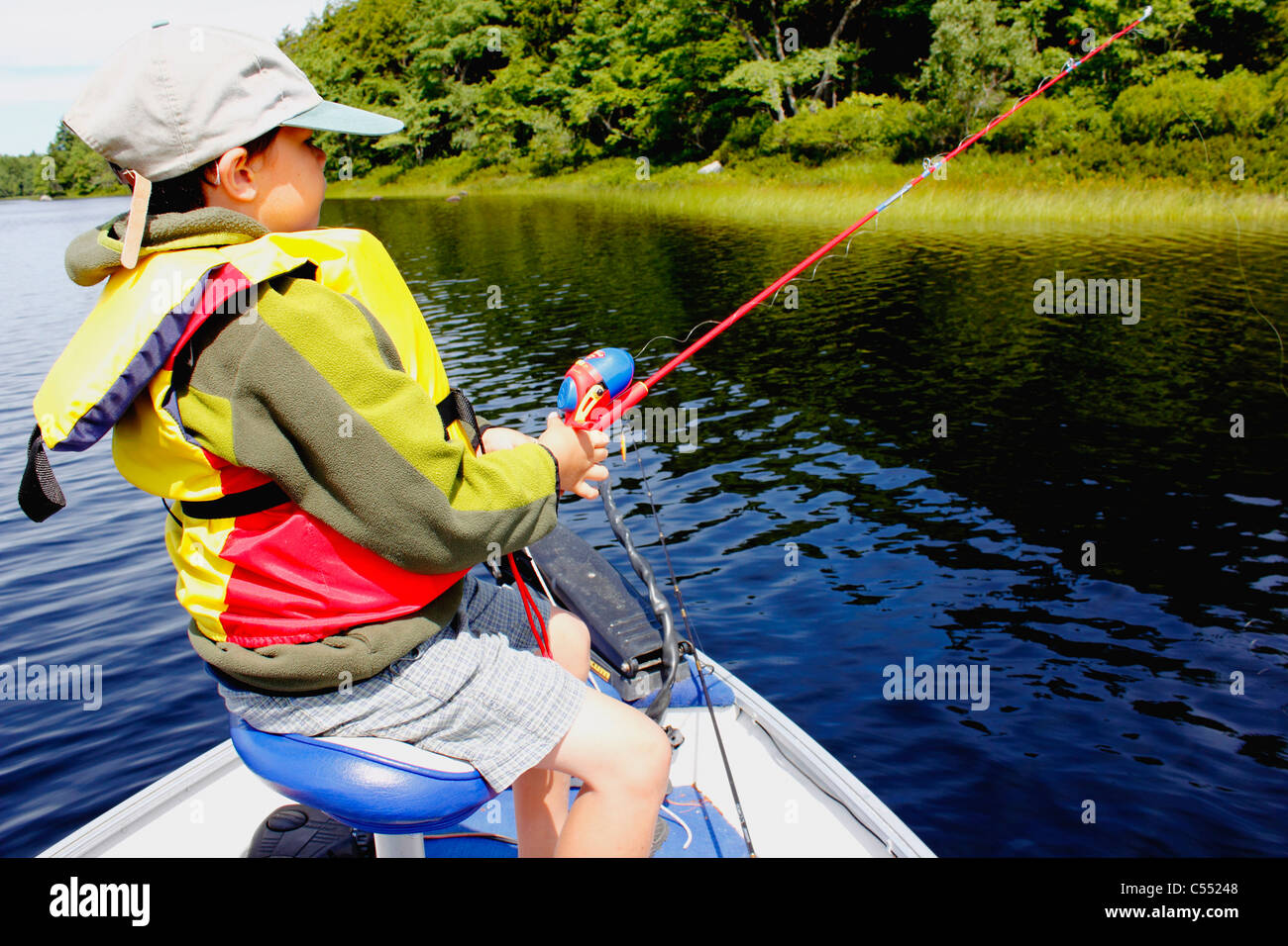 Boy bass fishing in a lake Stock Photo, Royalty Free Image 37605464