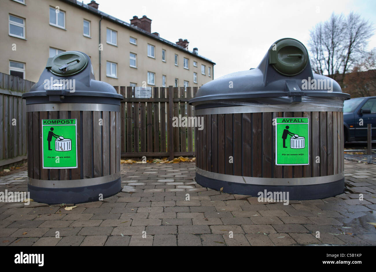 Two large bins named and 'waste' representing recycling Stock