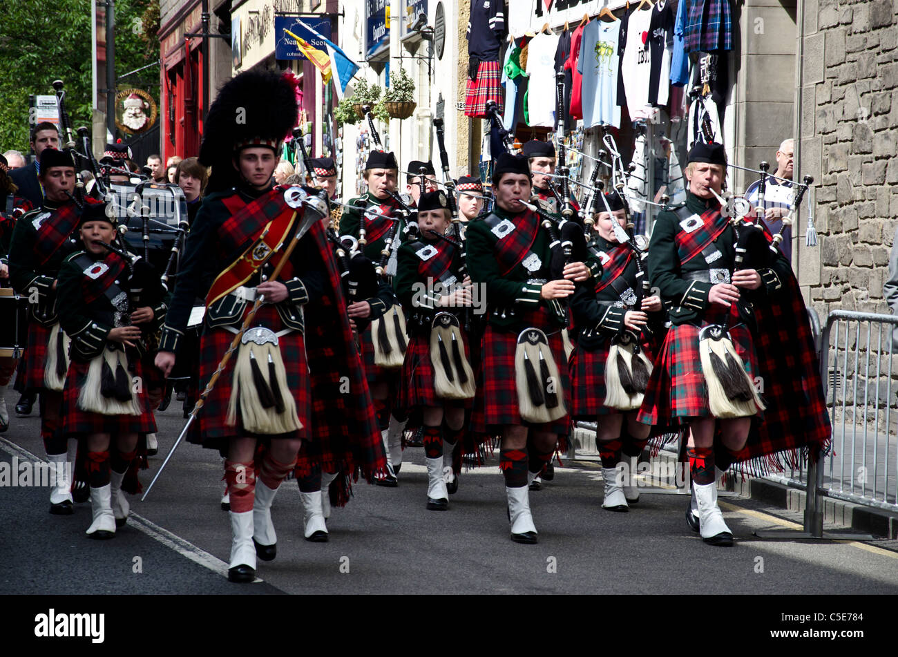 Parade down Edinburgh's Royal Mile to celebrate the Queen opening a