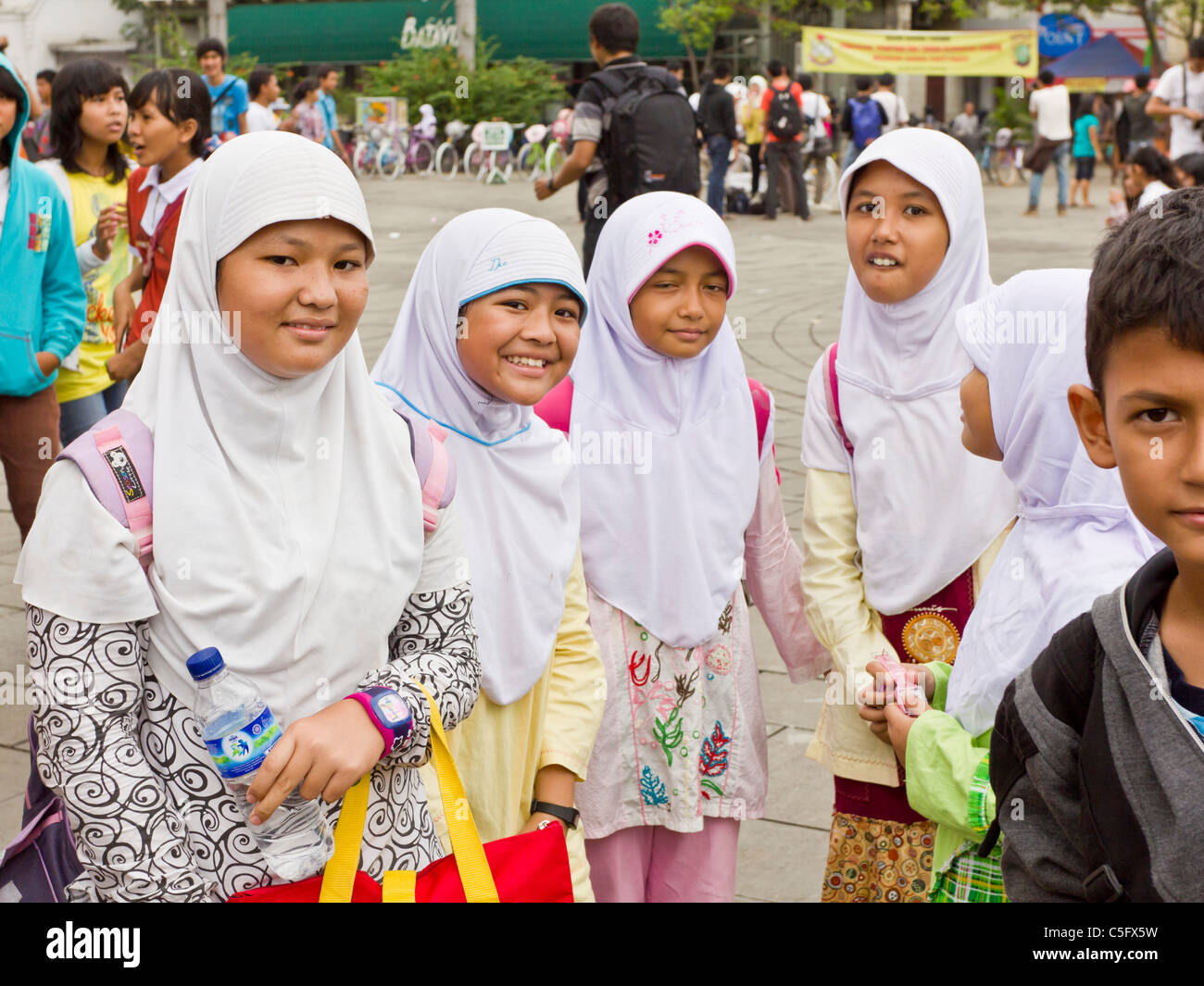 Group of Indonesian school children enjoying a day out at the Stock