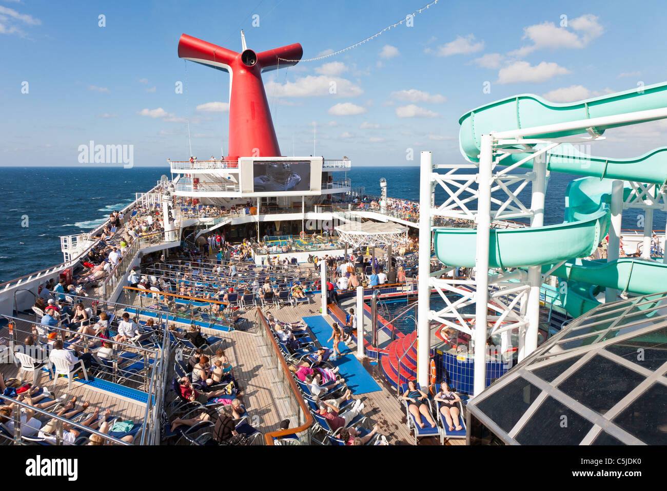 Cruise passengers watching NFL football game on deck of Carnival's 