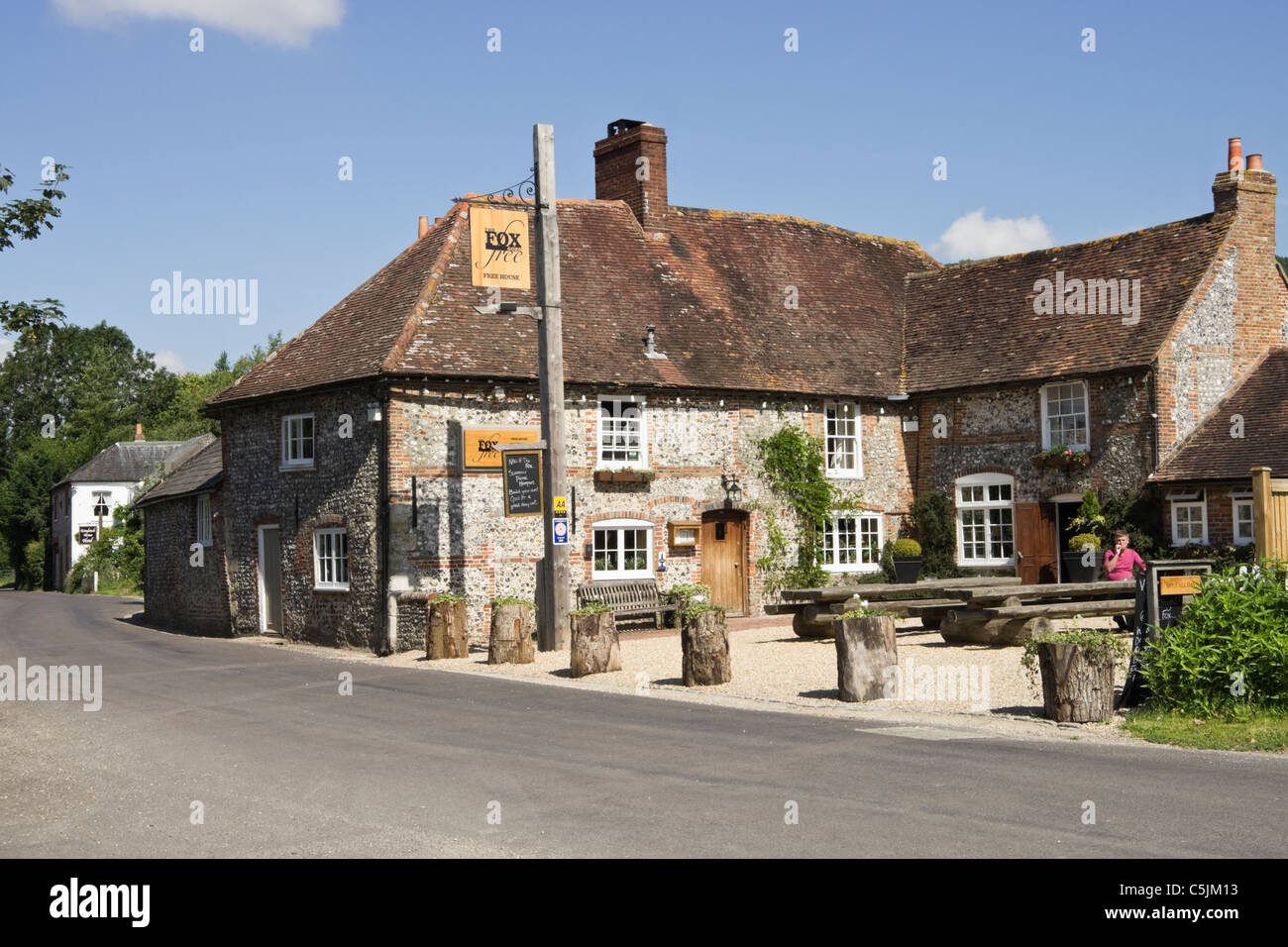 Traditional flintstone country village pub in South Downs National Stock Photo, Royalty Free