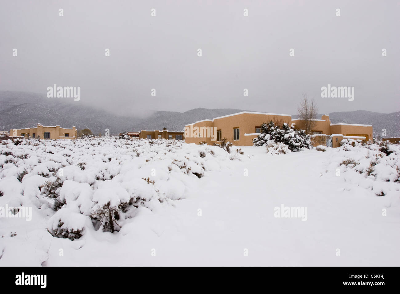 Adobe homes in winter, Taos, New Mexico Stock Photo, Royalty Free Image