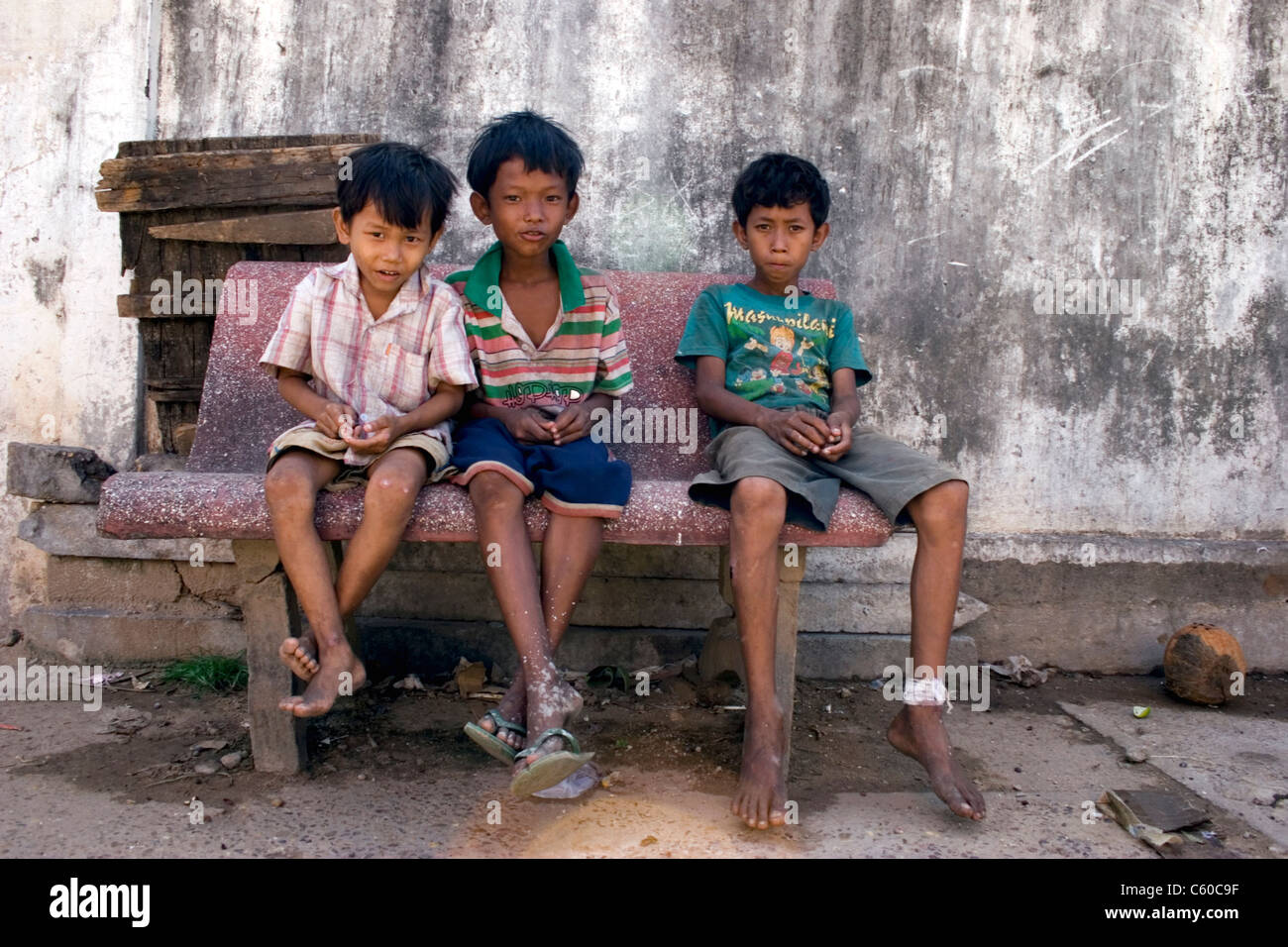 Young street child boys living in poverty who search garbage for Stock
