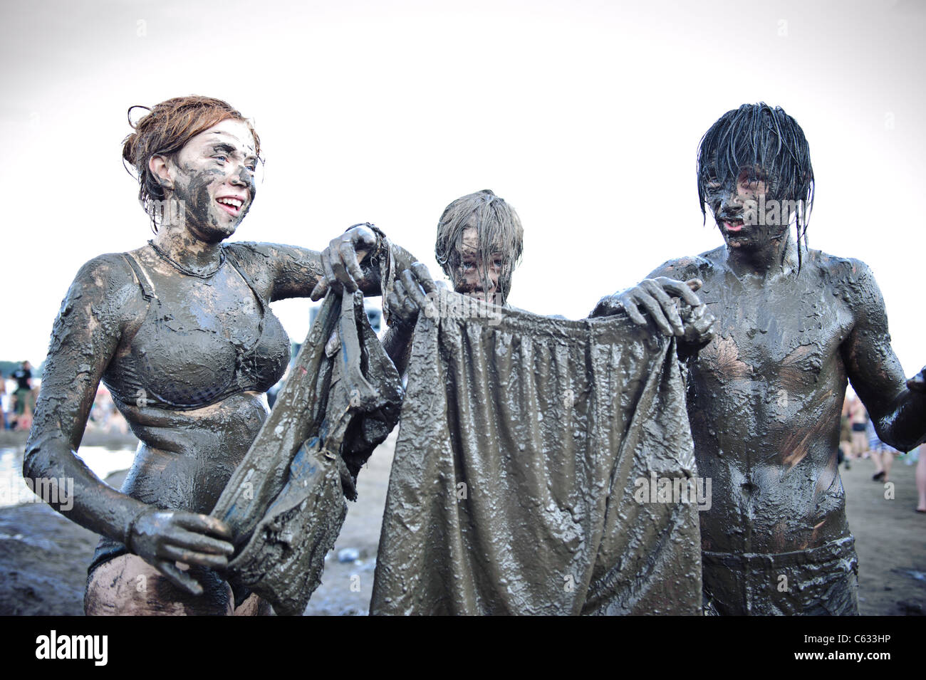 people showing their clothes covered in mud at the Przystanek Stock