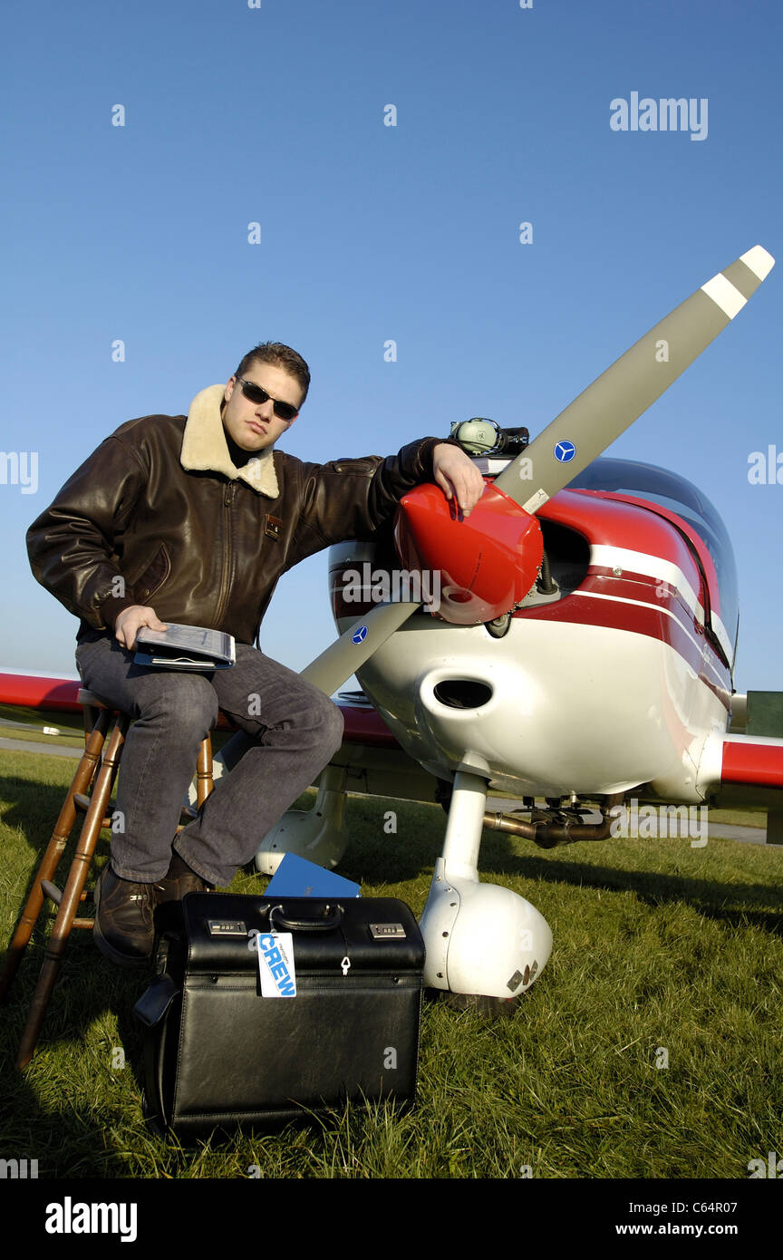 Private pilot posing front of propeller of small plane Robin DR400