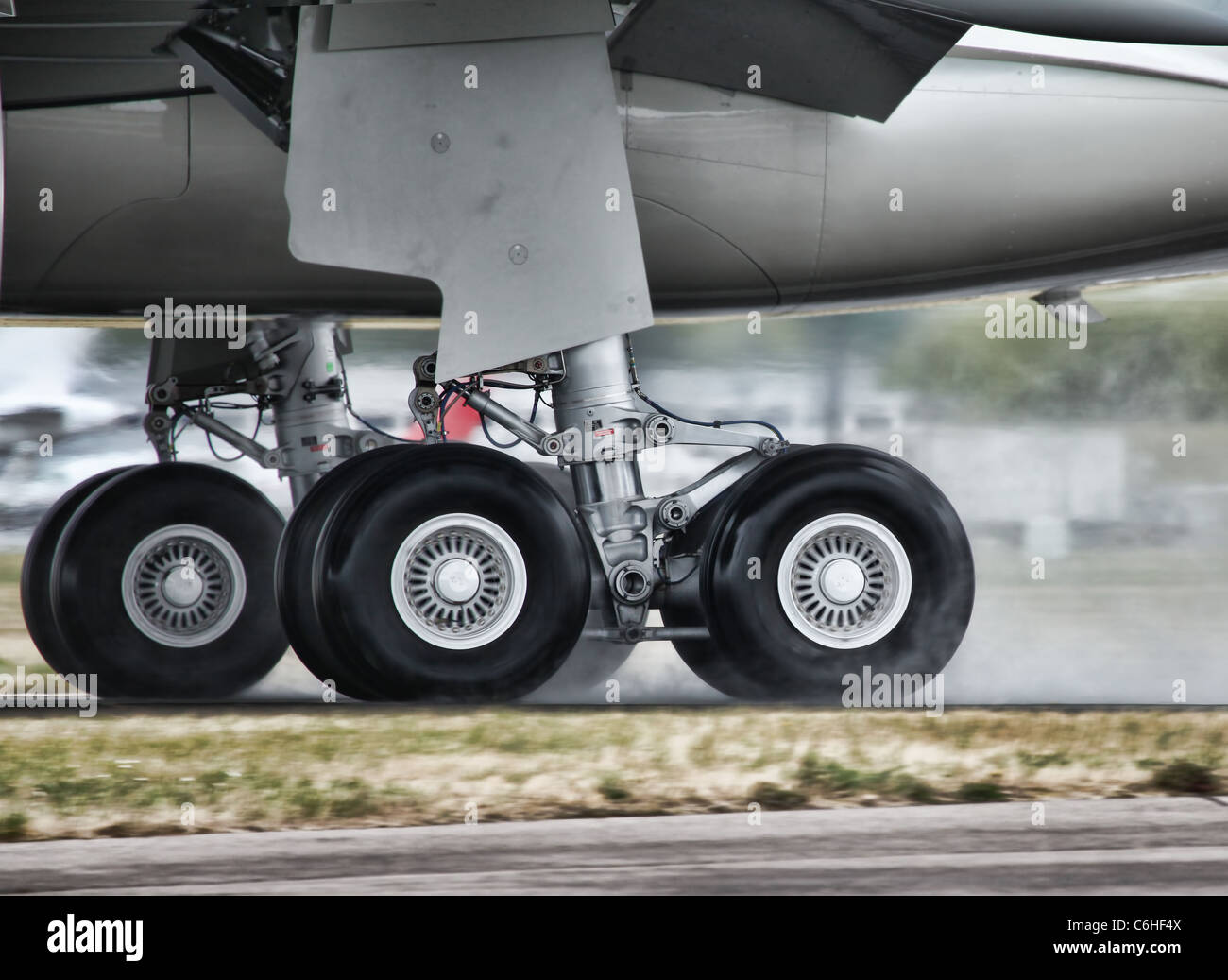Aircraft Landing on a Wet Runway Stock Photo, Royalty Free Image
