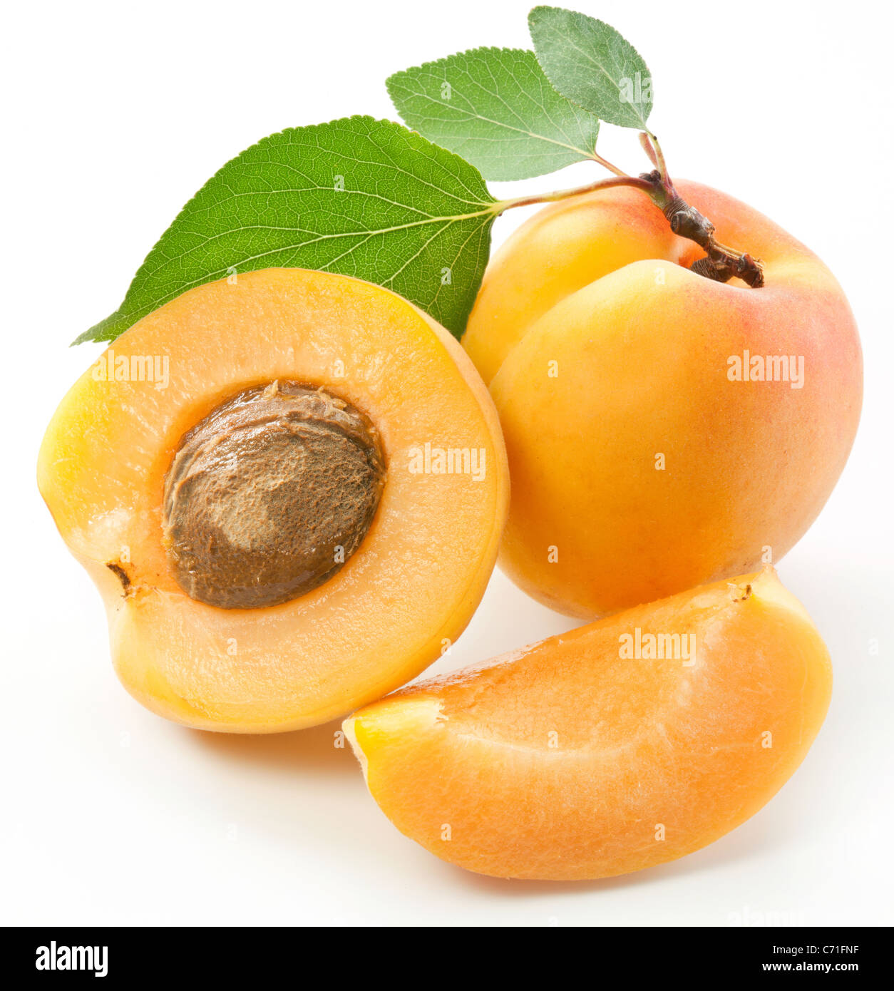 Apricots With Leaves On A White Background Stock Photo Alamy