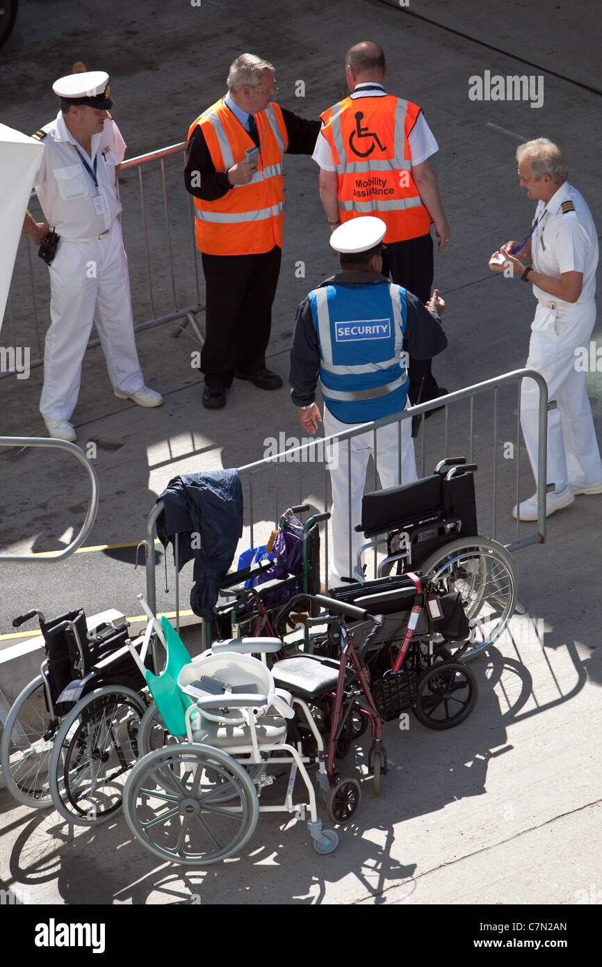Loading disabled passenger luggage and wheelchairs on Cruise Stock