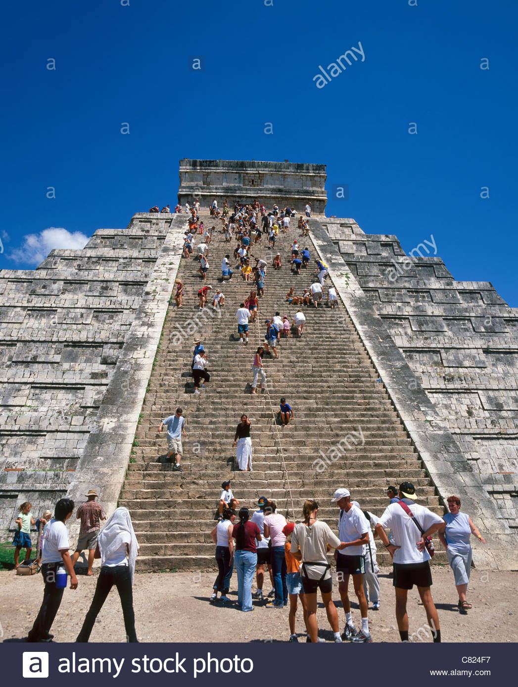 Mexico, Yucatan, Chichen Itza, tourists climbing steps of El Castillo