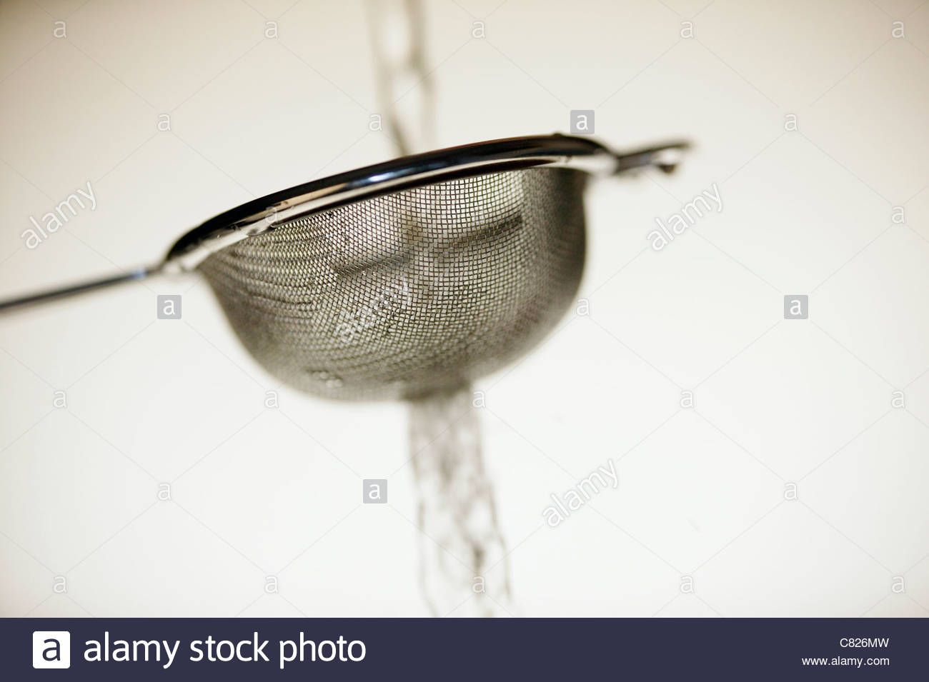 Pouring water in a sieve Stock Photo 39387177 Alamy