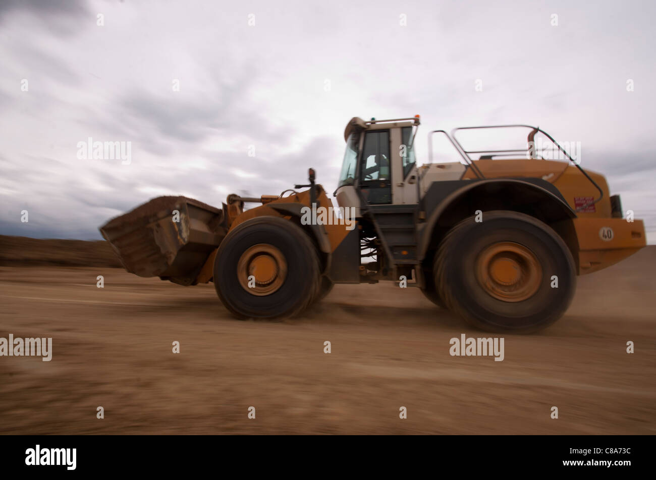 Front loading shovel working in a quarry Stock Photo, Royalty Free