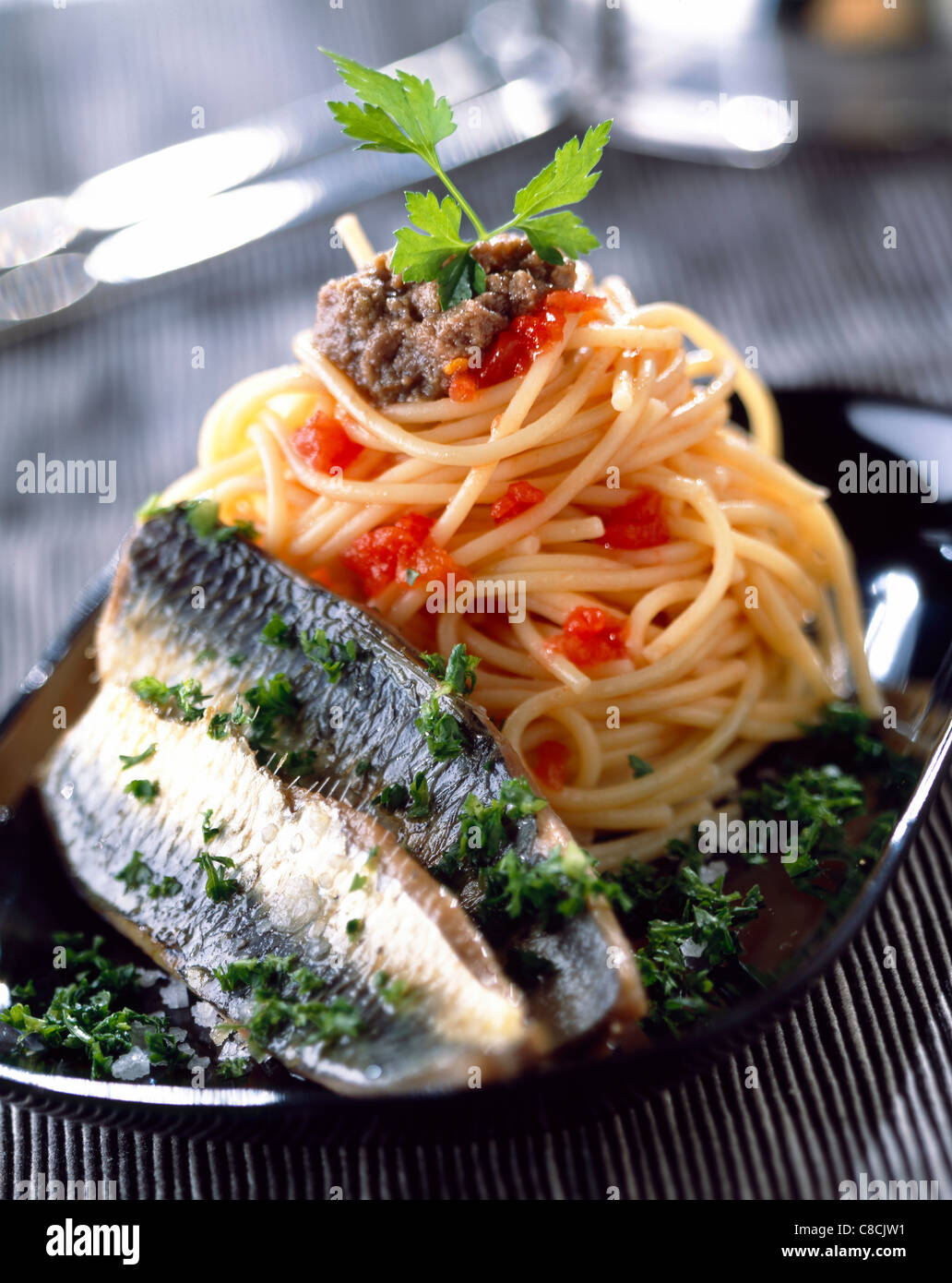 Spaghetti with sardines and anchovies Stock Photo, Royalty Free Image