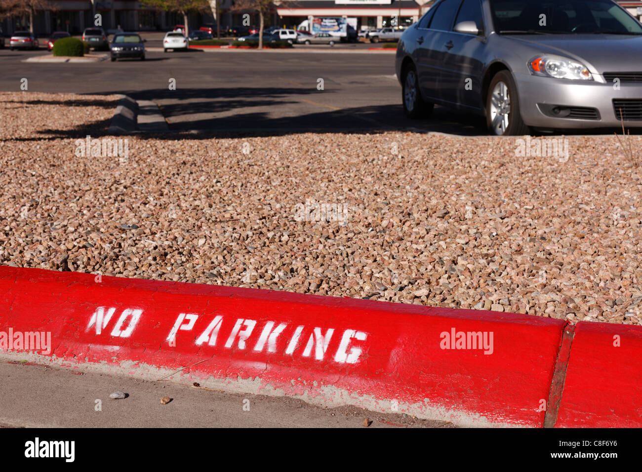 What are the rules regarding parking next to a street curb that is painted red?