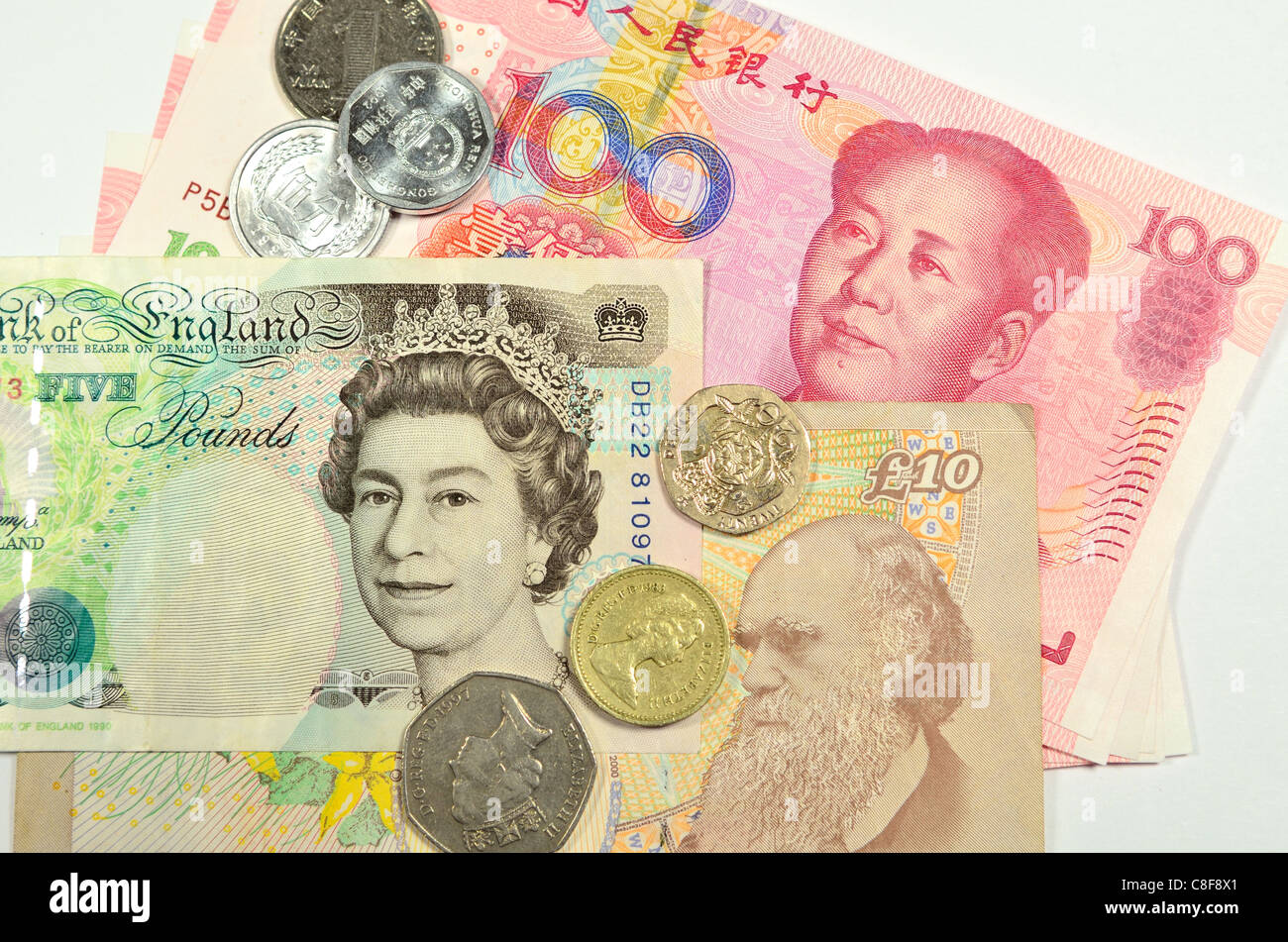 British Pound And Chinese Yuan Bank Notes And Coins Stock Photo 